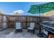 Private patio with seating, umbrella, and grill at 8051 Wolff St # C, Westminster, CO 80031