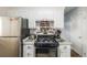 Clean kitchen featuring a gas stove and ample counter space at 8051 Wolff St # C, Westminster, CO 80031