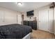 Primary bedroom with a large bed and lots of storage at 8051 Wolff St # C, Westminster, CO 80031