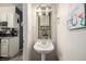 Small bathroom with pedestal sink and shower/tub combo at 8051 Wolff St # C, Westminster, CO 80031