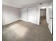 Spacious bedroom with neutral carpeting and double closets at 6800 E Tennessee Ave # 232, Denver, CO 80224