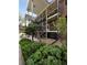 Brick building exterior with landscaping and stairs at 6800 E Tennessee Ave # 232, Denver, CO 80224