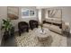 Living room with beige couch and contemporary decor at 6800 E Tennessee Ave # 232, Denver, CO 80224