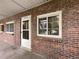Exterior view of a brick building with a single entrance at 6800 E Tennessee Ave # 232, Denver, CO 80224