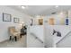 Upstairs hallway with carpeted floors, sitting area, and access to bedrooms at 752 Bishop Pine Way, Castle Rock, CO 80104