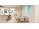 Bright dining area with table and chairs, adjacent to kitchen at , Aurora, CO 80019