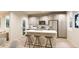 Modern kitchen with island, stainless steel appliances, and light cabinets at , Aurora, CO 80019
