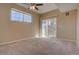 Bright bedroom with sliding door to private balcony at 17520 Nature Walk Trl # 201, Parker, CO 80134