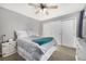 Bright bedroom with double bed, ceiling fan, and large closet at 920 Home Farm Cir, Westminster, CO 80234