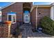 Brick entryway with a walkway leading to the front door at 920 Home Farm Cir, Westminster, CO 80234