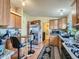 Kitchen boasts ample cabinetry and a convenient kitchen island at 6195 E 83Rd Pl, Commerce City, CO 80022