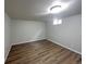 Finished basement bedroom with wood-look flooring at 123 Emerald St, Broomfield, CO 80020