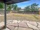 Large backyard with flagstone patio and mature trees at 123 Emerald St, Broomfield, CO 80020