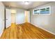 Bedroom with hardwood floors, closet, and access to bathroom at 123 Emerald St, Broomfield, CO 80020
