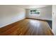 Spacious living room featuring hardwood floors and large window at 123 Emerald St, Broomfield, CO 80020
