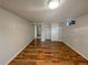 Finished basement bedroom with wood-look flooring and an adjacent closet at 123 Emerald St, Broomfield, CO 80020