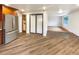 Open kitchen features stainless steel appliances and wood flooring at 123 Emerald St, Broomfield, CO 80020