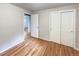Bright bedroom with hardwood floors and double door closet at 123 Emerald St, Broomfield, CO 80020