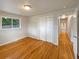Bedroom with hardwood floors and access to hallway at 123 Emerald St, Broomfield, CO 80020