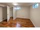 Spacious finished basement bedroom with wood-look flooring and ample closet space at 123 Emerald St, Broomfield, CO 80020
