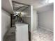 Basement laundry room with washer, dryer, and extra storage at 123 Emerald St, Broomfield, CO 80020