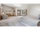 Large main bedroom with access to private patio and mountain views at 5197 Bear Mountain Dr, Evergreen, CO 80439