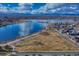 Aerial view of lakefront property with mountain views at 2031 Meade St, Denver, CO 80211