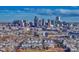 Aerial view of neighborhood with city skyline at 2031 Meade St, Denver, CO 80211