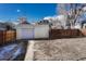 Backyard view showing a detached garage and a large yard at 2031 Meade St, Denver, CO 80211