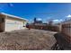 Backyard area with a wooden fence and detached garage at 2031 Meade St, Denver, CO 80211