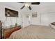Bright bedroom featuring a large bed, dresser, and a flat-screen TV at 2031 Meade St, Denver, CO 80211