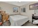 Cozy bedroom with a double bed, dresser, and window coverings at 2031 Meade St, Denver, CO 80211
