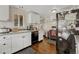 Kitchen with white cabinets and black appliances at 2031 Meade St, Denver, CO 80211