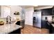 Modern kitchen with stainless steel appliances and granite countertops at 18397 E Alabama Pl # D, Aurora, CO 80017