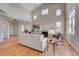 Open living room with hardwood floors, high ceilings, and large windows at 958 Eldorado Ln, Louisville, CO 80027