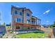 Two-story house with large deck and artificial turf at 958 Eldorado Ln, Louisville, CO 80027