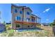 Two-story house with large deck and landscaping at 958 Eldorado Ln, Louisville, CO 80027