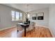 Bright dining room with hardwood floors and a modern chandelier at 958 Eldorado Ln, Louisville, CO 80027