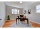Home office with hardwood floors, large window, and stylish desk at 958 Eldorado Ln, Louisville, CO 80027