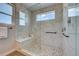 Spa-like shower with marble walls, pebble floor and built-in seat at 958 Eldorado Ln, Louisville, CO 80027