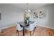 Bright dining room with hardwood floors and modern art at 958 Eldorado Ln, Louisville, CO 80027