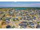Aerial view of a house in a new development with a lake nearby at 958 Eldorado Ln, Louisville, CO 80027