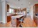 Spacious kitchen with an island, hardwood floors, and stainless steel appliances at 958 Eldorado Ln, Louisville, CO 80027