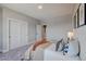 Bright bedroom with a queen bed and grey carpet at 958 Eldorado Ln, Louisville, CO 80027