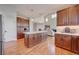 Modern kitchen with wood cabinets, quartz countertops, and stainless steel appliances at 958 Eldorado Ln, Louisville, CO 80027