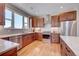 Kitchen with wood cabinets, stainless steel appliances, and an island at 958 Eldorado Ln, Louisville, CO 80027