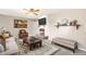 Living room with fireplace, large windows, and seating area at 406 Titan Ct, Aurora, CO 80011