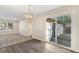 Open concept dining area with sliding door access to backyard at 5144 Billings St, Denver, CO 80239