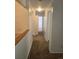 Clean hallway with carpeted floors and doors to bedrooms and bathroom at 14794 E 2Nd Ave # 111F, Aurora, CO 80011