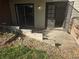 Small patio area with a concrete slab and wood retaining wall at 14794 E 2Nd Ave # 111F, Aurora, CO 80011